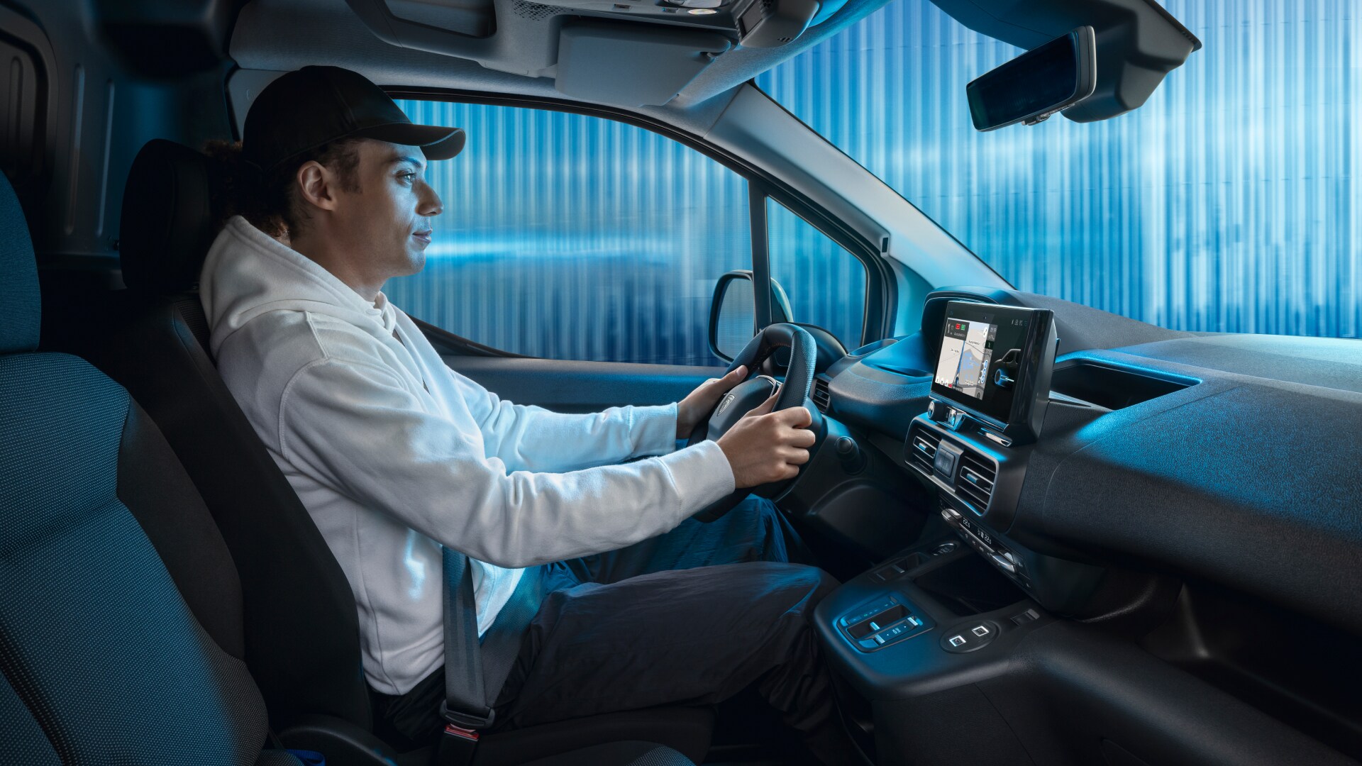 Man driving a PEUGEOT E-Partner