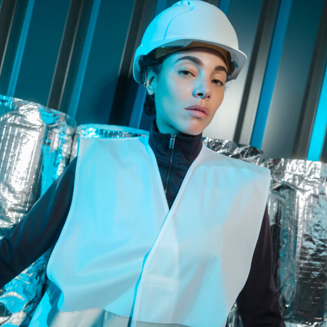Woman inside a customized PEUGEOT E-Partner with refrigerated interior panels